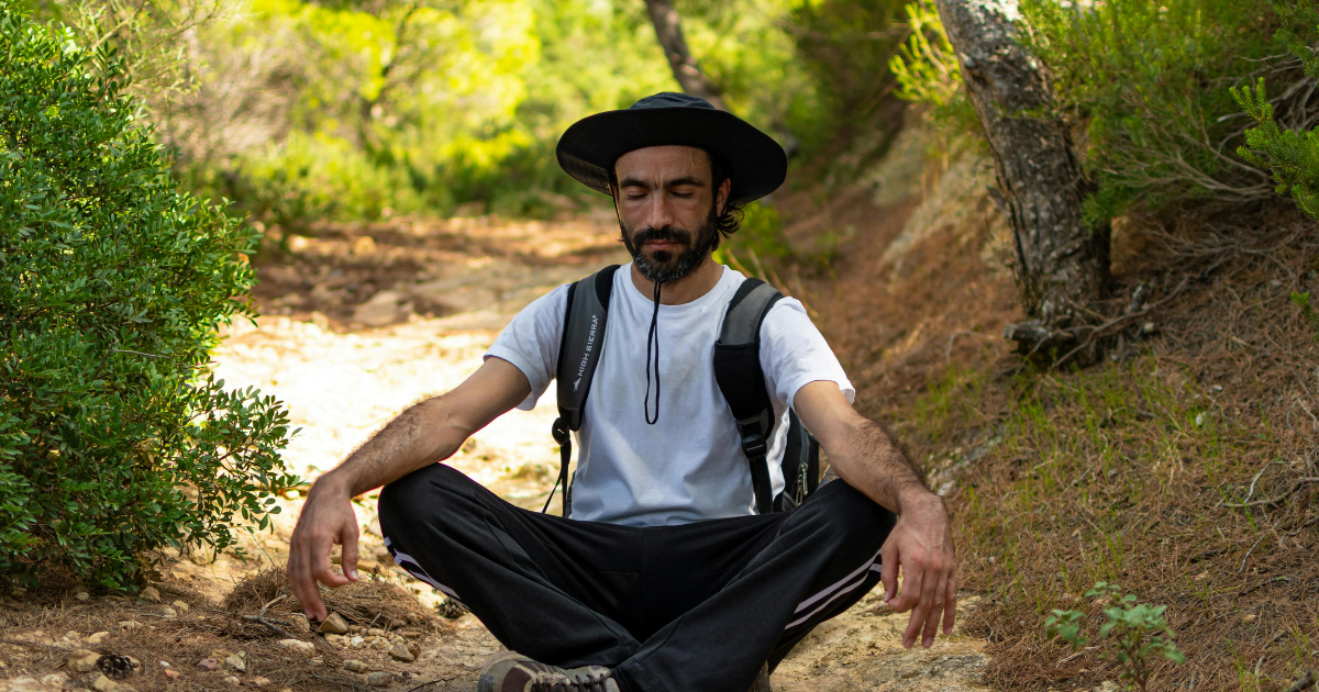 Man meditating in the forest